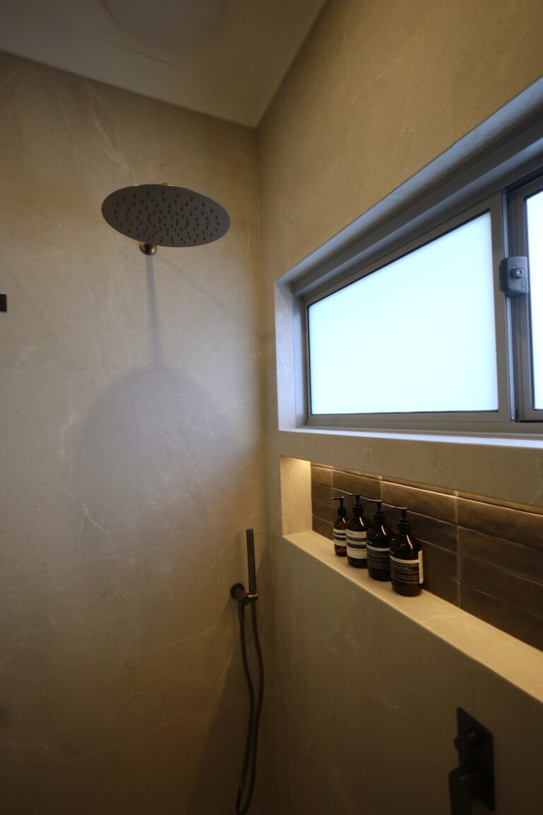 Rain shower head, hand shower and a recessed shower niche in a Dianella ensuite renovation, Perth